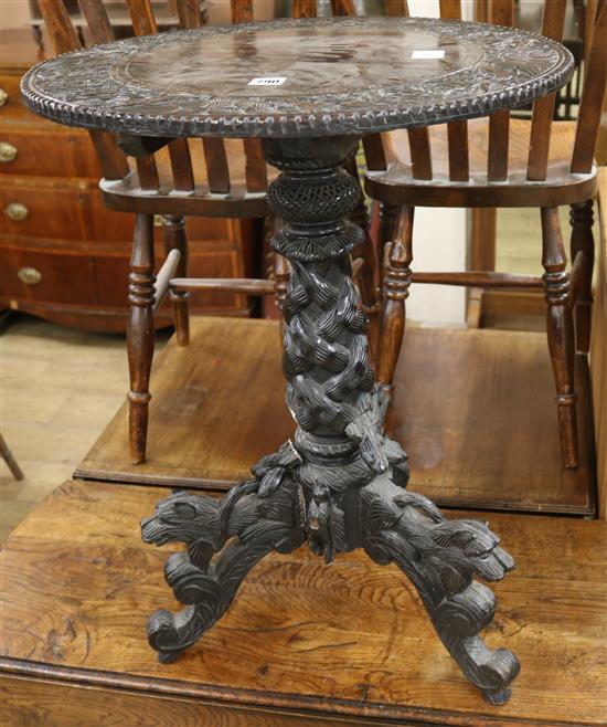 A carved tripod table W.55cm